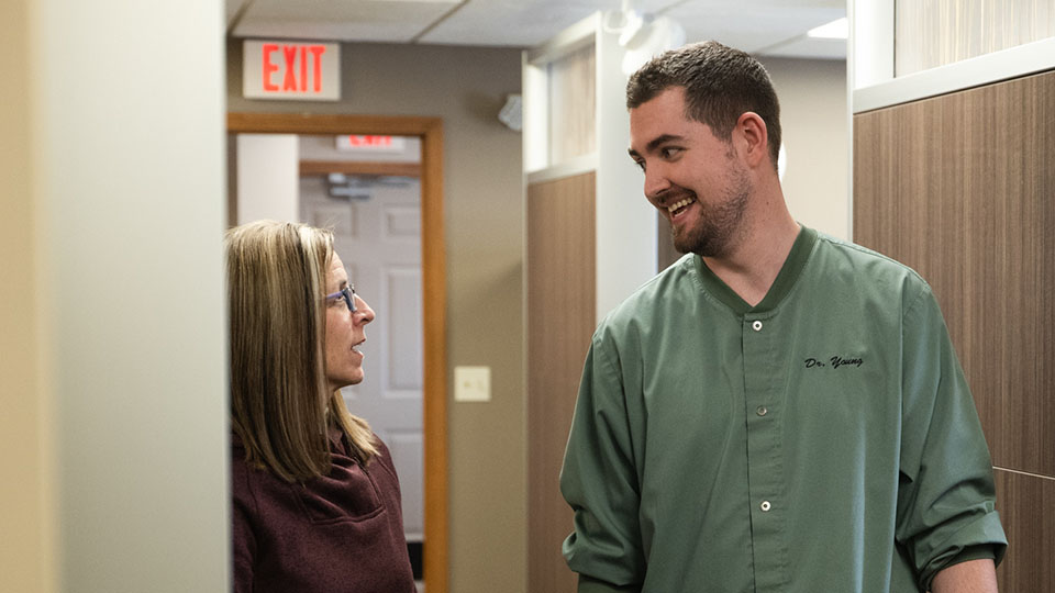 Female patient speaking with Washington, Michigan dentist