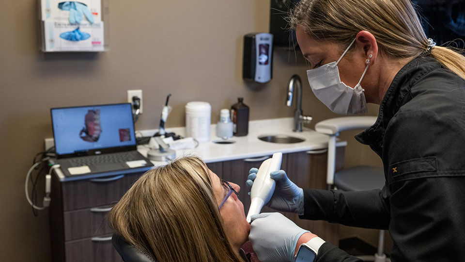 Female hygienist at Romeo, Michigan dentist
